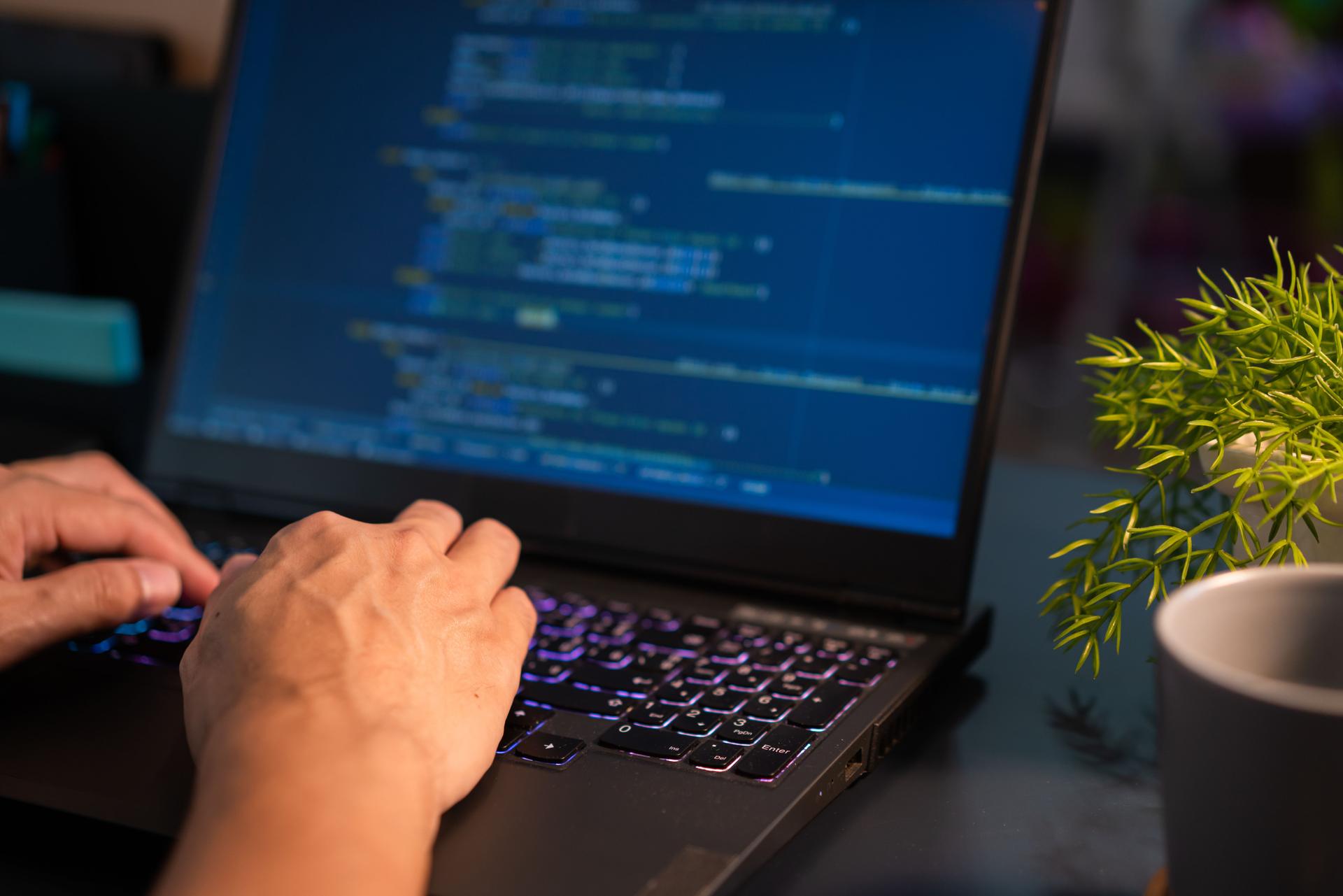 Freelance Software developers Hands working from home in the night time. Working late